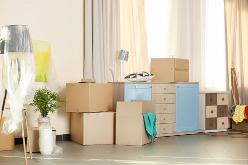 Removal team in Colliers Wood preparing furniture with safety equipment