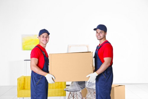 A specialist team handling a piano move through a Collierswood property