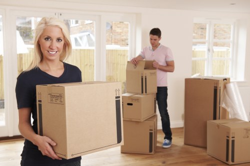 Office relocation team carrying equipment and boxes in Collierswood