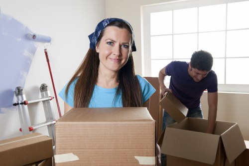 Fragile household items being wrapped for safe transport