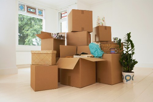 Movers using equipment to handle heavy items safely