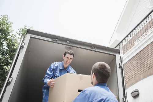 Movers carrying furniture carefully during a Collierswood house move
