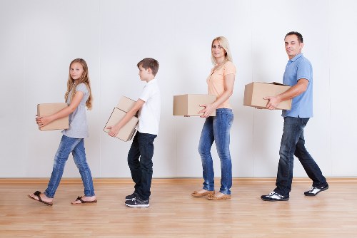 Professional moving truck service handling boxes and home items